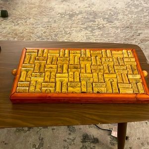 Selling a Corkscrew embedded decorated wood side platter/table.